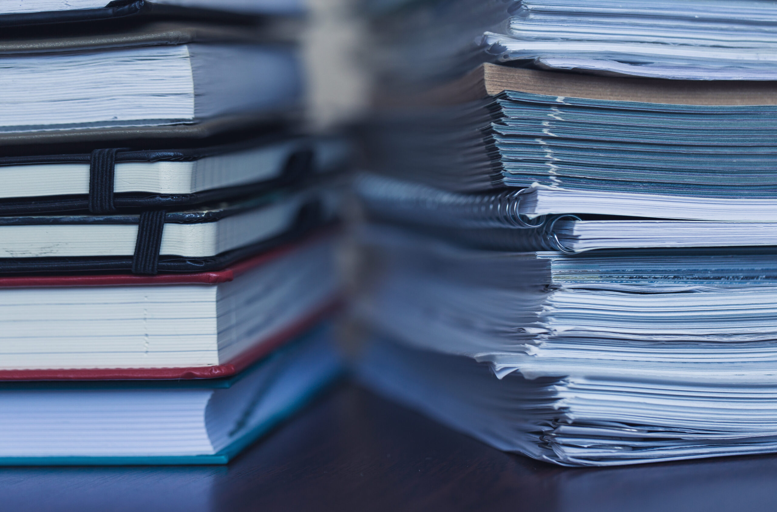 Accounting and taxes. Large pile of magazine and books stack of notebooks and books